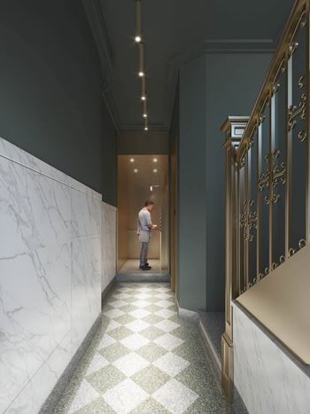 A man standing in a hallway with a door open